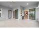 An enclosed outdoor patio with tiled floors and multiple access points to the home at 3345 Tesoro Cir, New Smyrna Beach, FL 32168