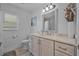 Well-lit bathroom with vanity, mirror, and toilet; lovely decor at 3615 Marisol Ct, New Smyrna Beach, FL 32168