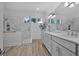 Spacious bathroom features walk-in shower, dual sinks, and a large mirror at 3615 Marisol Ct, New Smyrna Beach, FL 32168