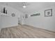 Light-filled bedroom with sleek flooring, white walls, and minimalist decor at 3615 Marisol Ct, New Smyrna Beach, FL 32168