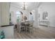 Open-concept dining area with abundant natural light and views into other rooms at 3615 Marisol Ct, New Smyrna Beach, FL 32168