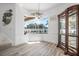 Dining room features beautiful view of the pool area and stylish nautical-themed decor at 3615 Marisol Ct, New Smyrna Beach, FL 32168