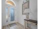 Bright foyer featuring coastal decor, a decorative mirror, and a stylish console table at 3615 Marisol Ct, New Smyrna Beach, FL 32168