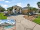 Stunning single-story home featuring a well-manicured lawn, mature palm trees, and a screened-in pool at 3615 Marisol Ct, New Smyrna Beach, FL 32168