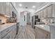 Bright kitchen features stainless steel appliances, stone counters, and plentiful rustic wood cabinets at 3615 Marisol Ct, New Smyrna Beach, FL 32168