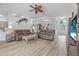 Bright living room boasts an open layout, updated decor, and comfortable furnishings at 3615 Marisol Ct, New Smyrna Beach, FL 32168