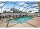 This screened-in pool features a fountain and plenty of room for entertaining at 3615 Marisol Ct, New Smyrna Beach, FL 32168