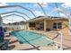 This screened-in pool features a covered patio, a water feature, and a view of the backyard at 3615 Marisol Ct, New Smyrna Beach, FL 32168
