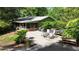 Large concrete backyard patio with a grill, dining set and a covered screened-in porch at 3720 Willow Ave, Deland, FL 32720