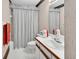 Cozy bathroom featuring a shower-tub combo with white and light-toned decor at 3720 Willow Ave, Deland, FL 32720
