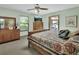 Relaxing bedroom with wooden furniture and a ceiling fan, creating a serene and inviting atmosphere at 3720 Willow Ave, Deland, FL 32720