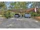 Covered carport with ample parking space for multiple vehicles, providing protection from the elements at 3720 Willow Ave, Deland, FL 32720