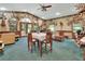Unique dining area with hunting decor, table with seating, and large windows at 3720 Willow Ave, Deland, FL 32720