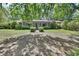 Inviting home with a charming front porch and well-manicured lawn, offering a welcoming curb appeal at 3720 Willow Ave, Deland, FL 32720