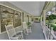 Relaxing front porch with rocking chairs, perfect for enjoying the peaceful surroundings and neighborhood charm at 3720 Willow Ave, Deland, FL 32720