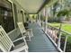 Cozy front porch with rocking chairs, a porch swing, and traditional decor at 3720 Willow Ave, Deland, FL 32720