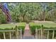 Charming home featuring a brick pathway to a lovely front yard and beautiful surrounding landscape at 3720 Willow Ave, Deland, FL 32720