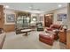 Inviting living room with comfortable seating, including a sofa and leather armchairs at 3720 Willow Ave, Deland, FL 32720