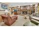 Cozy living room features a brick fireplace, built-in bookshelves, and comfortable seating at 3720 Willow Ave, Deland, FL 32720