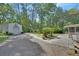 Metal outbuilding in wooded backyard at 3720 Willow Ave, Deland, FL 32720