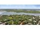 Picturesque aerial shot of property and its lush surrounding landscape next to the water at 4901 Sailfish Dr, Ponce Inlet, FL 32127