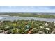 Stunning aerial view highlighting the property's location near the lush landscape and water at 4901 Sailfish Dr, Ponce Inlet, FL 32127