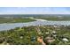 Scenic aerial shot shows homes near river, offering stunning waterfront views at 4901 Sailfish Dr, Ponce Inlet, FL 32127