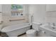 Traditional bathroom featuring a clawfoot tub and classic fixtures at 4901 Sailfish Dr, Ponce Inlet, FL 32127