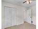Bedroom features tile floors, double door closet and ceiling fan at 4901 Sailfish Dr, Ponce Inlet, FL 32127