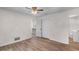 Bedroom featuring a ceiling fan, light flooring and a closet at 4901 Sailfish Dr, Ponce Inlet, FL 32127