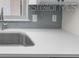 Quartz countertop with stainless faucet and backsplash at 4901 Sailfish Dr, Ponce Inlet, FL 32127