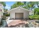 Detached two car garage with flat panel garage door at 4901 Sailfish Dr, Ponce Inlet, FL 32127