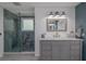 Bathroom boasting double vanities, modern fixtures, and glass-enclosed shower at 516 Spotted Sandpiper Dr, Daytona Beach, FL 32119