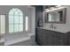 Well-lit bathroom featuring a large window, vanity with granite counters at 516 Spotted Sandpiper Dr, Daytona Beach, FL 32119