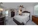 Bedroom with dark wood furniture, carpet, and a ceiling fan at 516 Spotted Sandpiper Dr, Daytona Beach, FL 32119