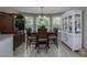 Elegant dining room with bay window and stylish furniture at 516 Spotted Sandpiper Dr, Daytona Beach, FL 32119