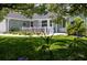 Quaint porch adorned with festive decorations and lush greenery at 516 Spotted Sandpiper Dr, Daytona Beach, FL 32119