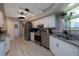 Modern kitchen with stainless steel appliances, granite counters, and contemporary lighting at 516 Spotted Sandpiper Dr, Daytona Beach, FL 32119