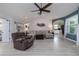 Open-concept living space with hardwood floors and neutral-toned furniture at 516 Spotted Sandpiper Dr, Daytona Beach, FL 32119