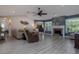 Spacious living room features a fireplace, ceiling fan, and ample seating at 516 Spotted Sandpiper Dr, Daytona Beach, FL 32119