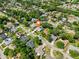 Neighborhood aerial view showcasing the home's location amidst lush greenery and nearby amenities at 934 Tall Pine Dr, Port Orange, FL 32127