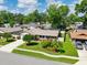 An aerial shot of a well-maintained home showcases beautiful landscaping at 934 Tall Pine Dr, Port Orange, FL 32127