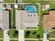 Aerial view of the property showing the house, pool, spacious backyard, and surrounding neighborhood at 934 Tall Pine Dr, Port Orange, FL 32127