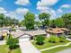 Aerial view of a single-story home showcasing landscaping, and a large driveway at 934 Tall Pine Dr, Port Orange, FL 32127