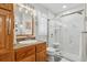 Bathroom features a marble tile shower with a frameless glass door and granite vanity at 934 Tall Pine Dr, Port Orange, FL 32127