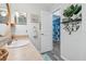 Bathroom features a large vanity and view of the walk-in closet at 934 Tall Pine Dr, Port Orange, FL 32127