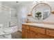 Bathroom features a shower and bathtub combo with wood vanity and sink at 934 Tall Pine Dr, Port Orange, FL 32127