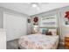 Bedroom features a ceiling fan, closet, and window with bright natural light at 934 Tall Pine Dr, Port Orange, FL 32127