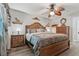 Comfortable bedroom featuring a decorative ceiling fan, furnishings, and accents at 934 Tall Pine Dr, Port Orange, FL 32127