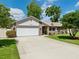 Charming single-story home with a well-manicured lawn and inviting curb appeal at 934 Tall Pine Dr, Port Orange, FL 32127